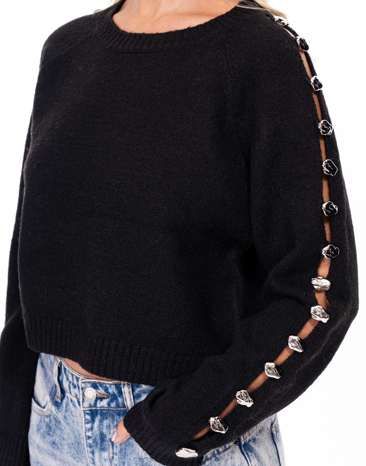 סריג פתחים בשרוול