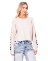 סריג פתחים בשרוול